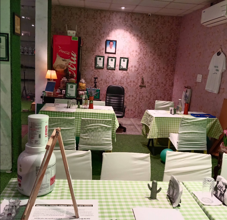 Cafe seating with green gingham tables